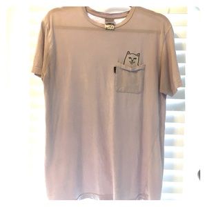 Light pink Ripndip tee shirt with cat pocket.